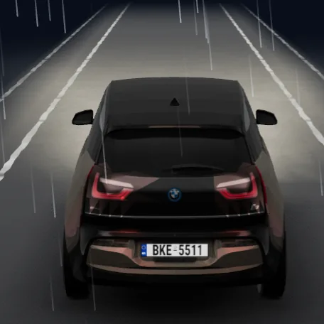 The i3 in the rain on a wet road